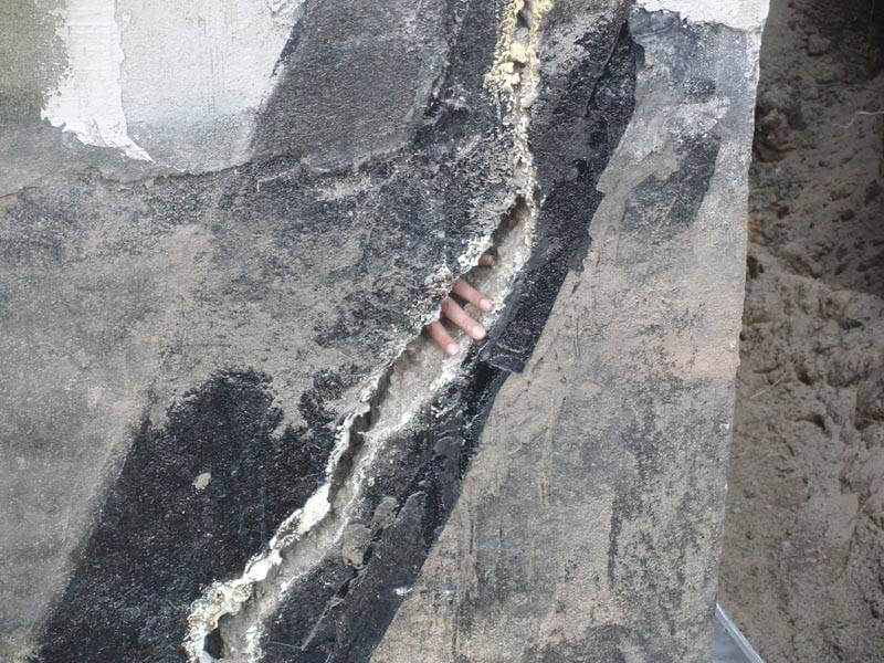 Large diagonal crack running across a foundation wall, showing signs of structural damage that needs immediate repair in Ottawa, Gatineau, or Kingston.