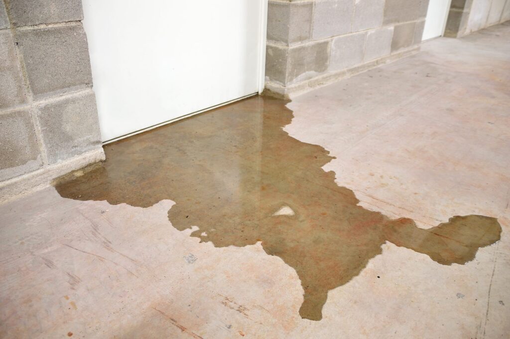 Standing water in a basement due to leaks, highlighting the need for basement waterproofing. Learn how to waterproof a basement effectively.