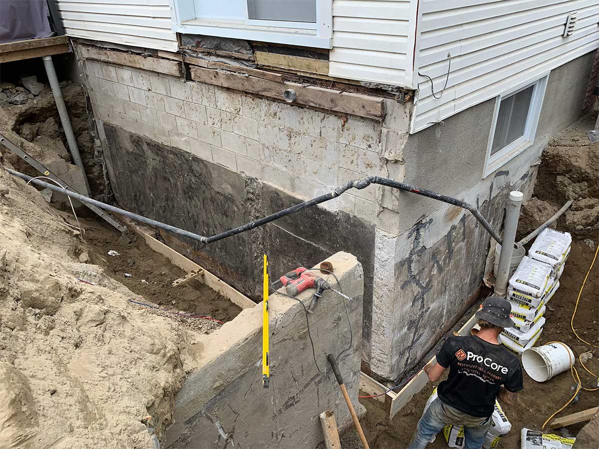 Repair person working on a foundation repair
